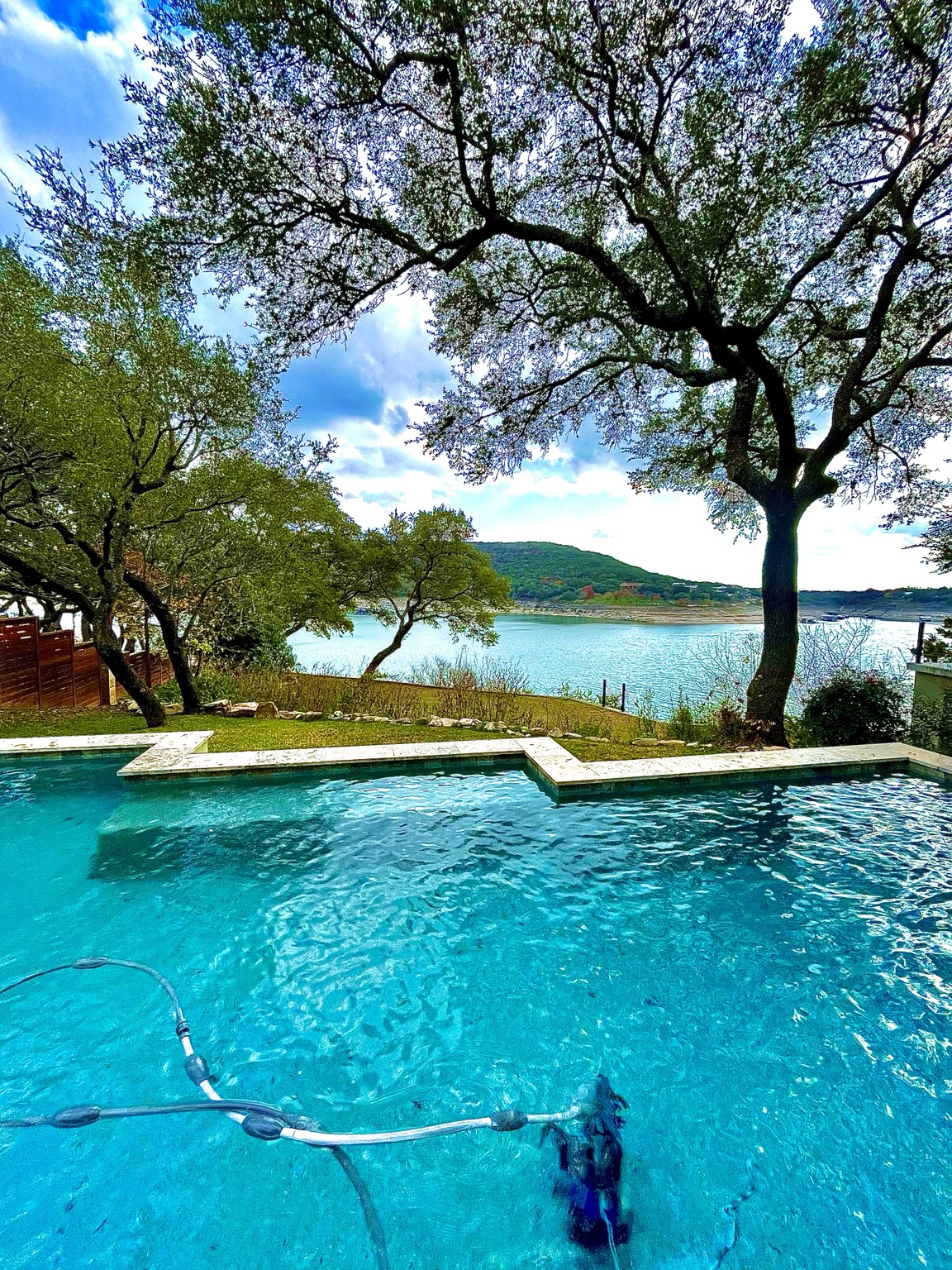 Pool maintenance at a clear Austin-area swimming pool